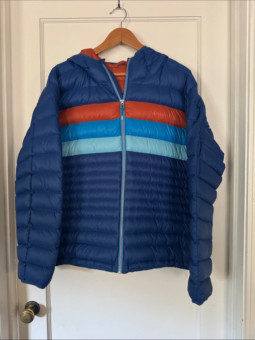 cotopaxi Blue Quilted Hooded Puffer Jacket with Orange and Light Blue Stripes